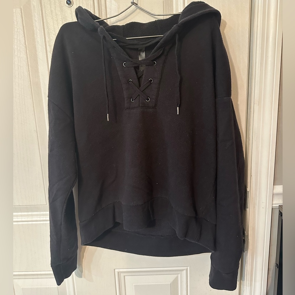 kyodan black sweatshirt w lace up detailing in the front